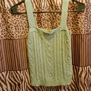 A small camo green sweater tank top made by Mine.